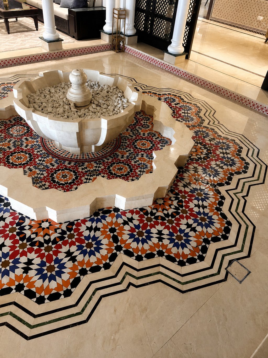 Custom Moroccan zellige flooring around a fountain in a private VIP villa in Abu Dhabi